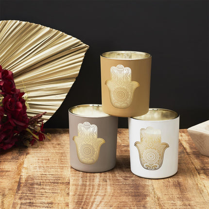 Aromātiskā svece stikla traukā ar zelta Hamsas simbolu