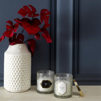 Aromātiskā svece stikla traukā ar vāciņu