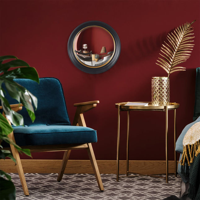 Dekoratīvo izliekto (konvekso) spogulis ar melni–zelta rāmi