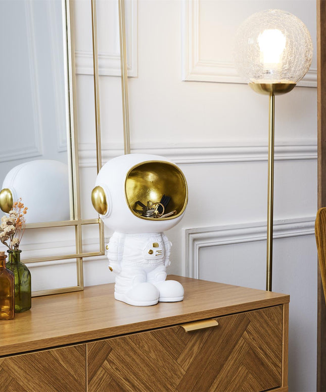 Decorative astronaut figure with storage compartment