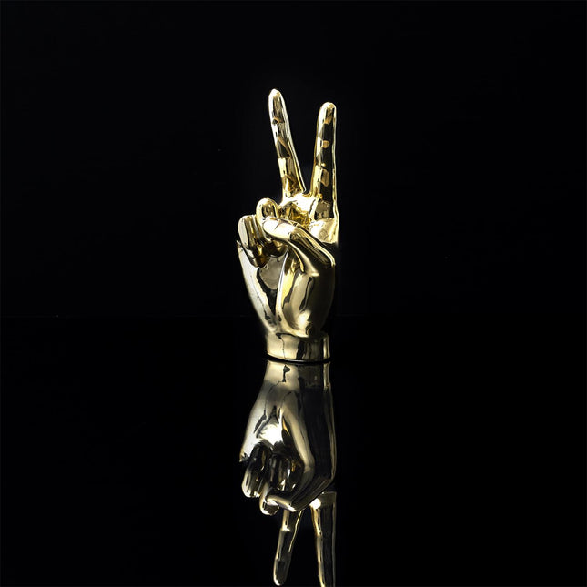 Keramikas dekoratīvā figūra – zelta rokas žests