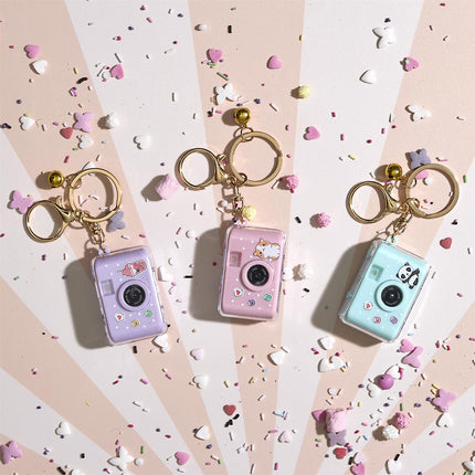 Kawaii fotoaparātiņa piekariņš ar gaismas un skaņas efektu