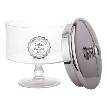 Stikla saldumu trauks uz kājas ar sudraba krāsas vāku