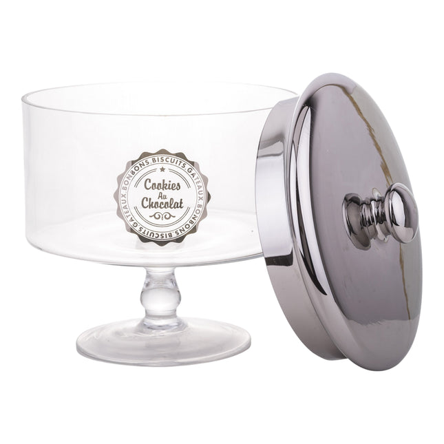 Stikla saldumu trauks uz kājas ar sudraba krāsas vāku