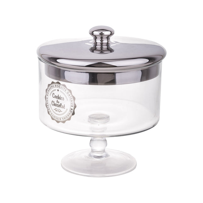 Stikla saldumu trauks uz kājas ar sudraba krāsas vāku